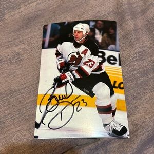 Bruce Driver Autographed postcard featuring career stats. NJ Devils #23.